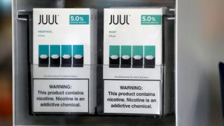 Packages of Juul mint flavored e-cigarettes are displayed at San Rafael Smokeshop on November 07, 2019 in San Rafael, California.