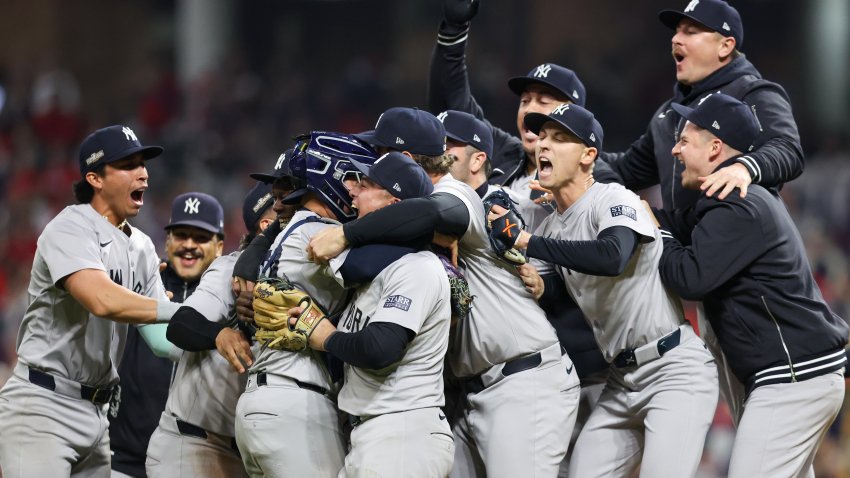 Members of the New York Yankees celebrate on the field after defeating the Cleveland Guardians in Game 5 of the ALCS presented by loanDepot at Progressive Field on Saturday, October 19, 2024 in Cleveland, Ohio. (Photo by Lauren Leigh Bacho/MLB Photos via Getty Images)