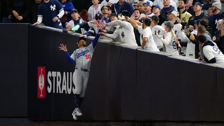 NEW YORK, NY – OCTOBER 29:  Mookie Betts #50 of the Los Angeles Dodgers makes a leaping catch against the wall during Game 4 of the 2024 World Series presented by Capital One between the Los Angeles Dodgers and the New York Yankees at Yankee Stadium on Tuesday, October 29, 2024 in New York, New York. (Photo by Daniel Shirey/MLB Photos via Getty Images)