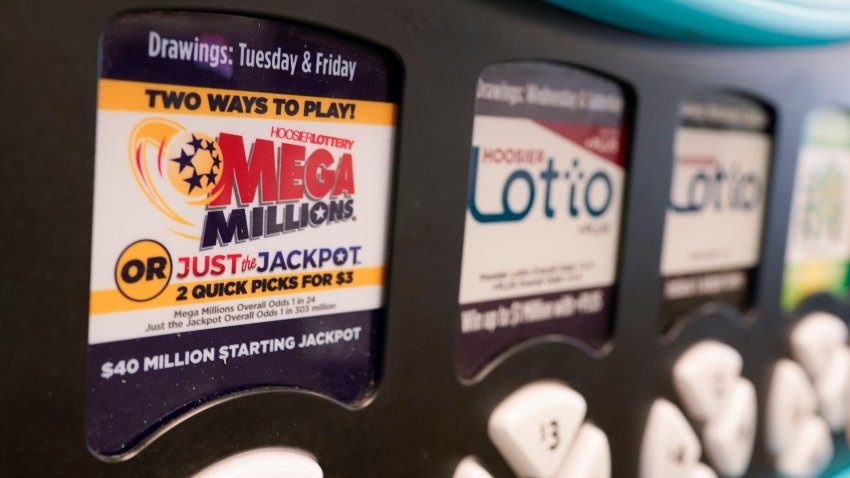 FILE - A Mega Millions logo is displayed on a vending machine at the Hoosier Lottery booth at the Indiana State Fair, Thursday, Aug. 3, 2023, in Indianapolis.