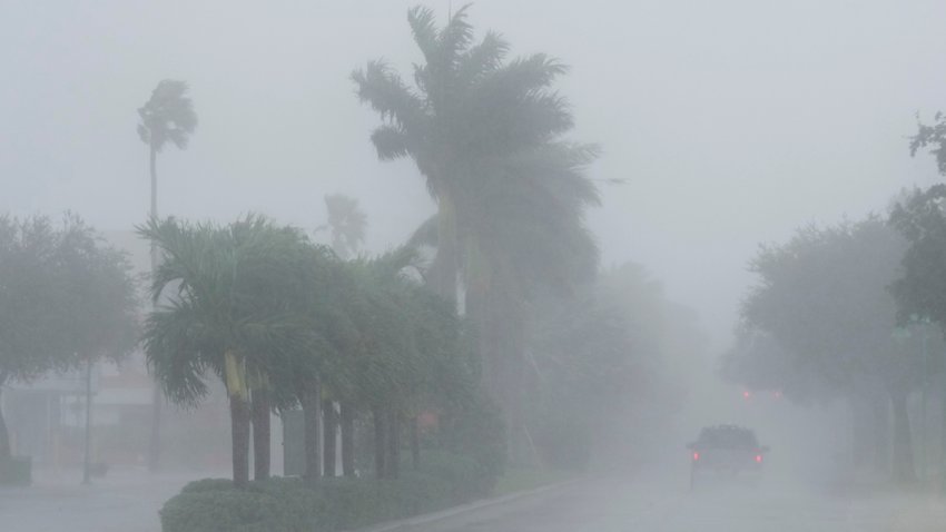 A Lee County Sheriff's officer patrols the streets of Cape Coral, Fla., as heavy rain falls ahead of Hurricane Milton, Wednesday, Oct. 9, 2024.