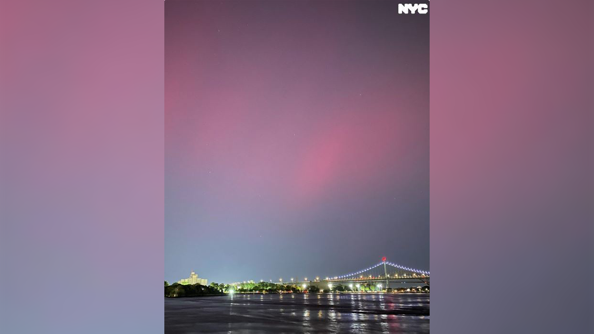 This photo, posted by @nycgov on social media platform X, shows the northern lights from behind Gracie Mansion on the Upper East Side of Manhattan.