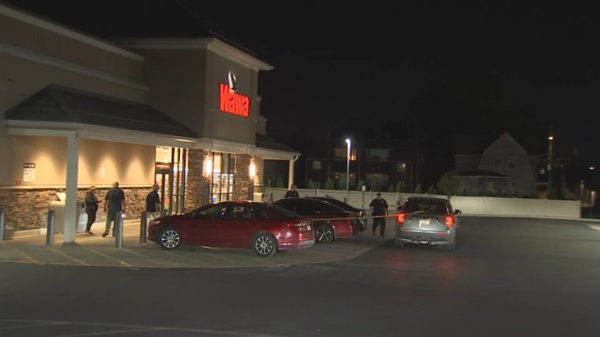 Police tape surrounds the front of a Wawa store in Delaware County