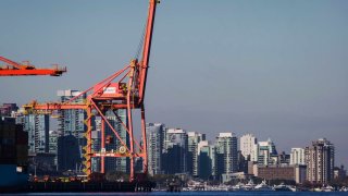 A gantry crane stands in the DP World Ltd. terminal at Port Metro Vancouver in Vancouver, British Columbia, Canada, on Wednesday, Sept. 19, 2018.