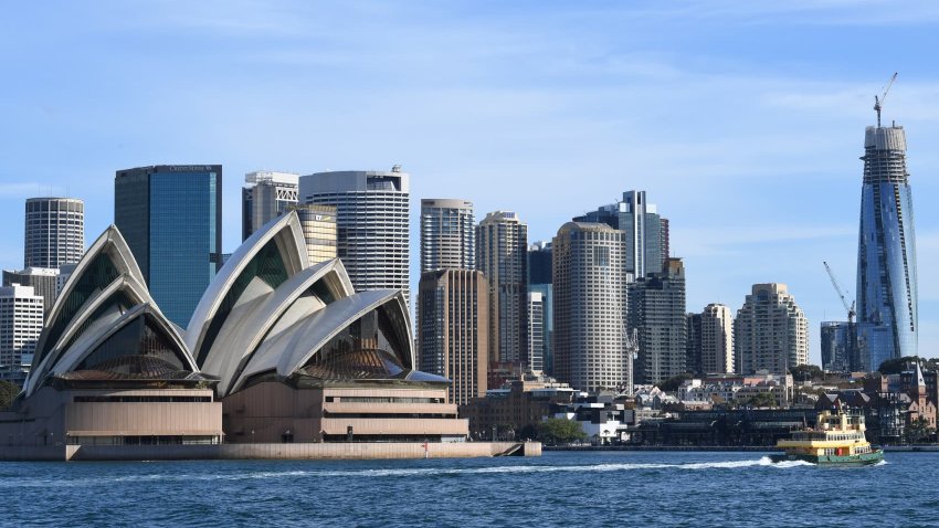 A Sydney ferry passes the Opera House and skyline of the central business district area on May 12, 2020 in Sydney, Australia.