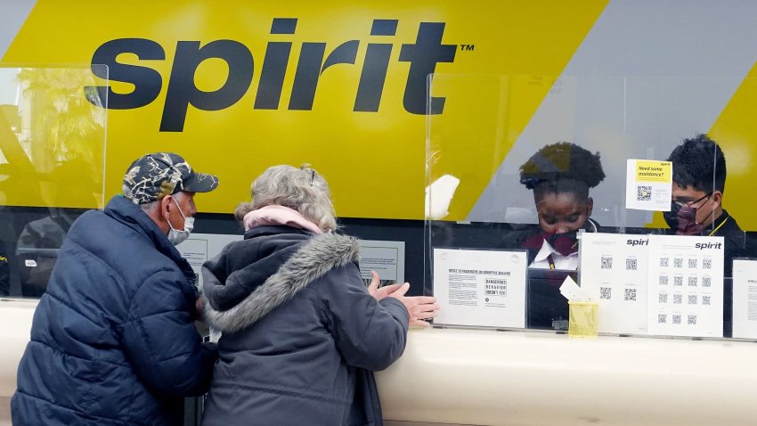 Passengers check in at the Spirit Airlines counter at the Fort Lauderdale-Hollywood International Airport on February 07, 2022 in Fort Lauderdale, Florida.