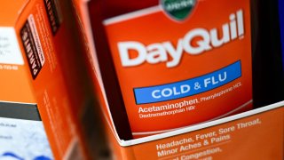 A bottle of Vicks DayQuil cold and flu medicine containing phenylephrine is displayed for sale in a CVS Pharmacy store in Hawthorne, California, on Sept. 12, 2023.