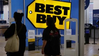 People walk into a Best Buy store in a Brooklyn mall on August 29, 2023 in New York City. 