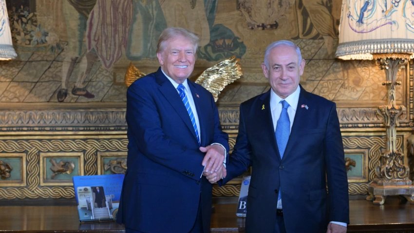 Former US President Donald Trump (L) shakes hands with Israeli Prime Minister Benjamin Netanyahu (R) as they pose for a photo within their meeting at Mar-a-Lago estate, in Palm Beach, Florida, United States on July 26, 2024. 