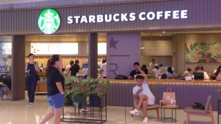 People seen around the Starbucks coffee store in Shenzhen, China.