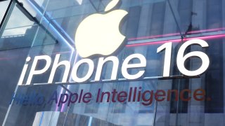 An iPhone 16 signage is seen on the window at the Fifth Avenue Apple Store on new products launch day on September 20, 2024 in New York City. 