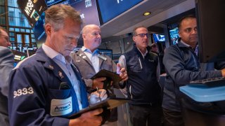 Traders work on the New York Stock Exchange (NYSE) floor on November 12, 2024 in New York City.