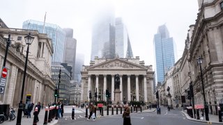 View looking towards the Royal Exchange and in the City of London where the glass architecture of the tower 22 Bishopsgate disappears into mist on 6th November 2024 in London, United Kingdom.