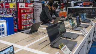 Laptop computers inside a Best Buy store in Union City, California, US, on Friday, Nov. 24, 2023.