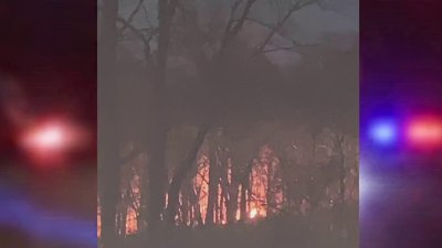 Crews urge caution after battling brush fire in residential area of North Haven