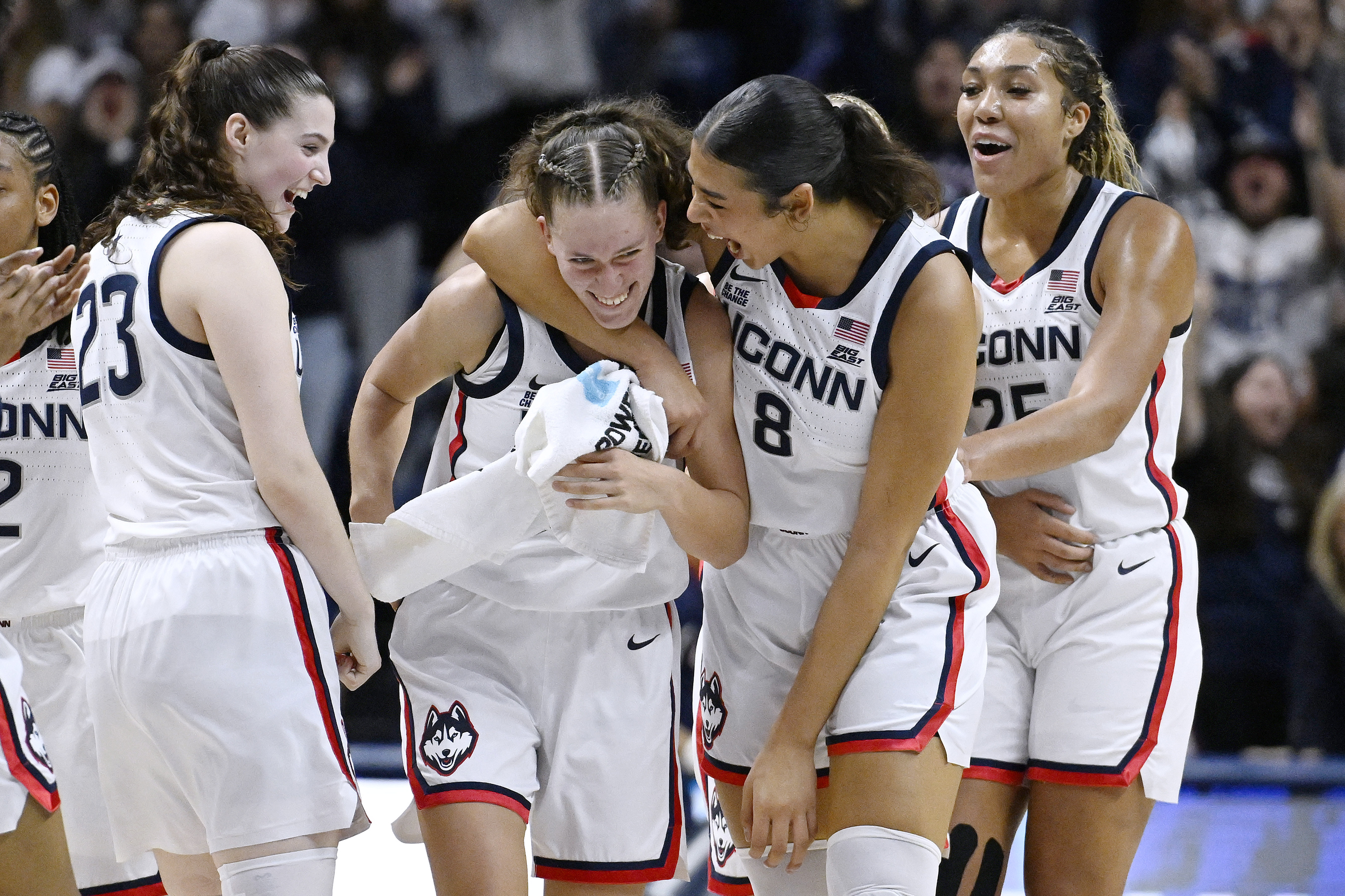 UConn guard Morgan Cheli (23), center Jana El Alfy (8) and forward Ice Brady (25)