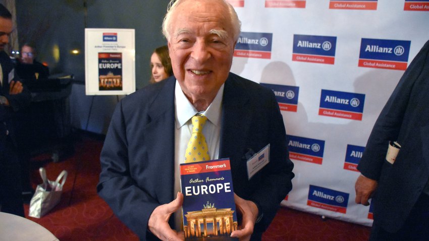 Guidebook author and publisher Arthur Frommer holds up the latest book of his publish company, 'Arthur Frommer's Europe,' in New York, USA, 18 November 2015.