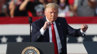 File. President Donald Trump dances to the music after speaking during his campaign event at The Villages Polo Club on October 23, 2020 in The Villages, Florida. President Trump continues to campaign against Democratic presidential nominee Joe Biden leading up to the November 3rd Election Day.