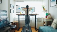 Woman at home office using a walking pad