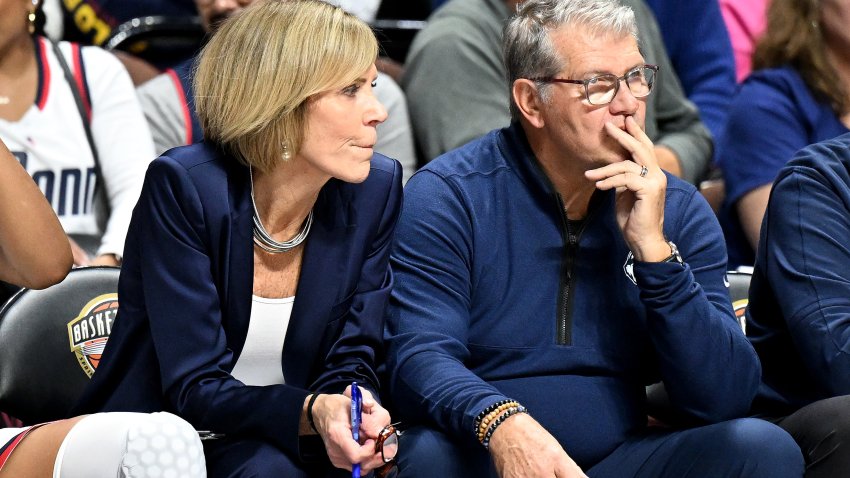 UNCASVILLE, CONNECTICUT – DECEMBER 10: Associate head coach Chris Dailey and Head coach Geno Auriemma of the UConn Huskies watch the game against the North Carolina Tar Heels at Mohegan Sun Arena on December 10, 2023 in Uncasville, Connecticut. (Photo by G Fiume/Getty Images)