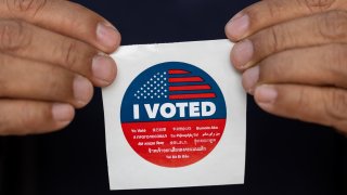 LOS ANGELES, CALIFORNIA – NOVEMBER 05: A voter receives a “I Voted” sticker after casting his ballot during the 2024 United States Presidential Election at a polling station on November 5, 2024 in Los Angeles, California. Today, voters cast their ballots to determine whether Republican nominee former President Donald Trump or Democratic nominee Vice President Kamala Harris will become the next President of the United States. (Photo by Qian Weizhong/VCG via Getty Images)