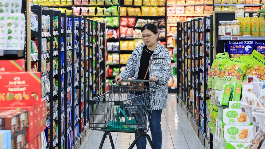 Customers shopping for vegetables at a supermarket in Nanjing, China.