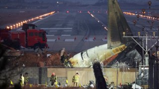 The wreckage of the Jeju Air aircraft that went off the runway and crashed lies at Muan International Airport, in Muan, South Korea, December 30, 2024.