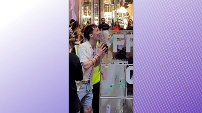 WATCH: Man gets tongue stuck to block of ice at mall in Australia