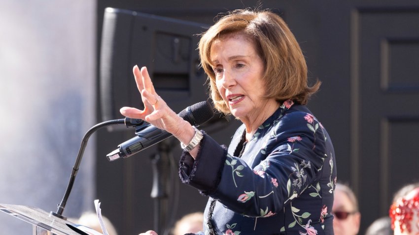 Nancy Pelosi speaks at podium