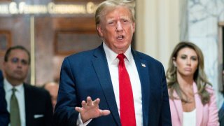 FILE – Former President Donald Trump speaks after exiting the courtroom for a break at New York Supreme Court, Dec. 7, 2023, in New York. Trump has secured a bond sufficient to support an $83.3 million jury award granted to writer E. Jean Carroll during a January defamation trial stemming from rape claims she made against Trump, his lawyer said Friday, March 8, 2024, as she notified the federal judge who oversaw the trial that an appeal was underway.(AP Photo/Eduardo Munoz Alvarez, File)