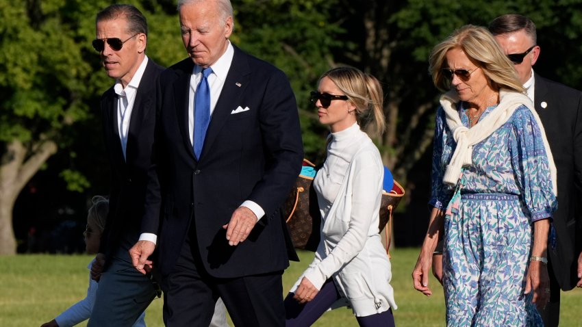 President Joe Biden, center, arrives at Fort Lesley J. McNair accompanied by grandson Beau Biden, obstructed from left, son Hunter Biden, Melissa Cohen Biden and first lady Jill Biden, Monday, July 1, 2024, in Washington, on return from Camp David.