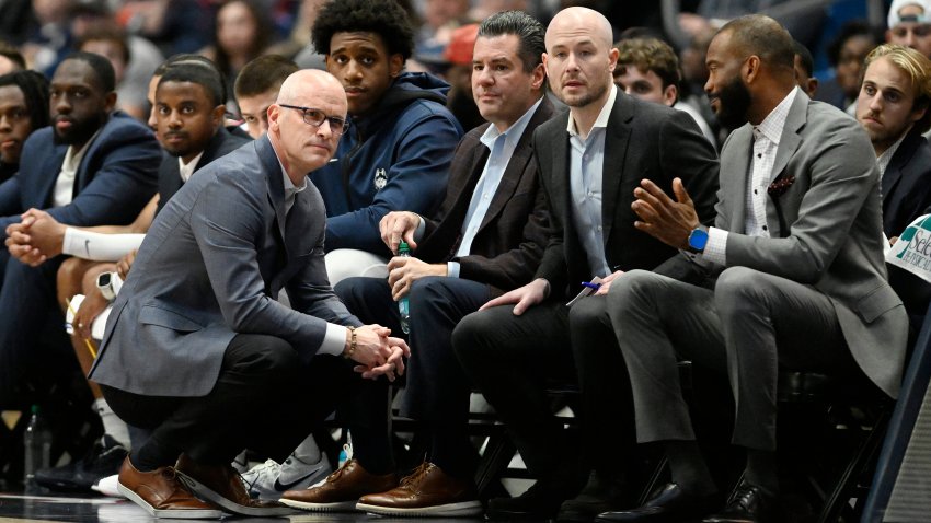 UConn head coach Dan Hurley, left, watches play with assistant coaches Tom Moore, second from left, Luke Murray, center, and associate head coach Kimani Young, right, in the first half of an NCAA college basketball game, Saturday, Nov. 30, 2024, in Hartford, Conn.