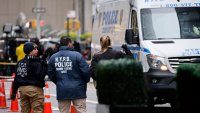 Members of the New York police crime scene unit investigate the scene outside the Hilton Hotel in midtown Manhattan where Brian Thompson, the CEO of UnitedHealthcare, was fatally shot Wednesday,  Dec. 4, 2024, in New York.