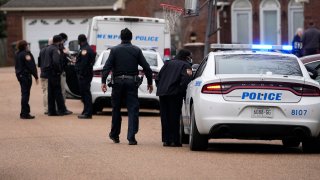 FILE – Members of the Memphis Police Department work a crime scene in Memphis, Tenn., Tuesday, Jan. 24, 2023.