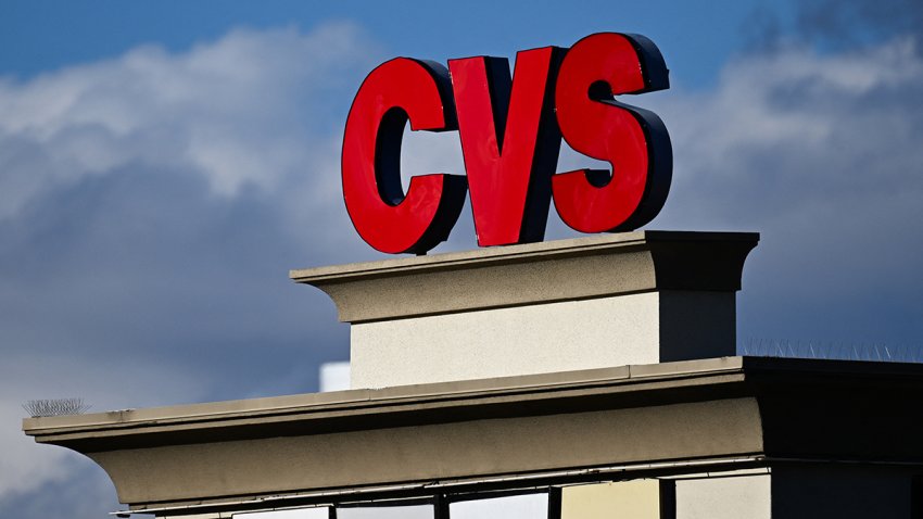 The CVS pharmacy logo is displayed on a sign above a CVS Health Corp. store in Las Vegas, Nevada on February 7, 2024. (Photo by Patrick T. Fallon / AFP) (Photo by