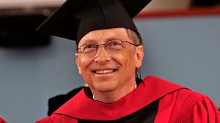 At Harvard University Bill Gates grins from ear to ear who looks over his honorary degree.