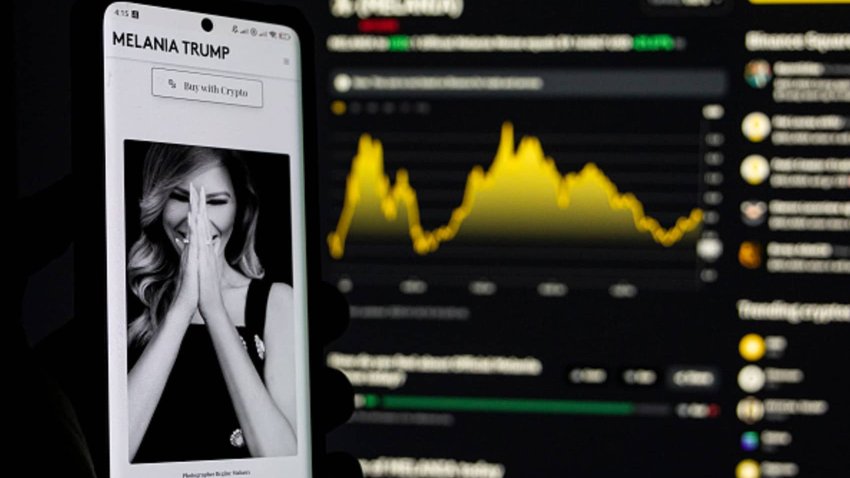 Photo illustration of Melania Meme, a memecoin launched by Melania Trump displayed on a smartphone and a computer screen with the current price charts showed from Binance cryptocurrency exchange page.