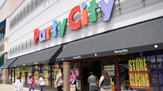 Shoppers seek closeout sale discounts at Party City in Stamford, Conn. July 3, 2023.