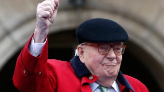 FILE - Former far-right National Front party leader Jean-Marie Le Pen clenches his fist at the statue of Joan of Arc, Monday May 1, 2017, in Paris.