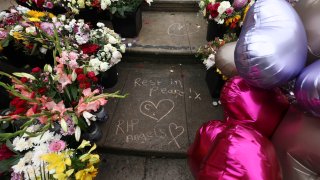 FILE – Tributes are seen outside the Town Hall in Southport, England, Aug. 5, 2024 after three young girls were killed in a knife attack at a Taylor Swift-themed holiday club the week before.