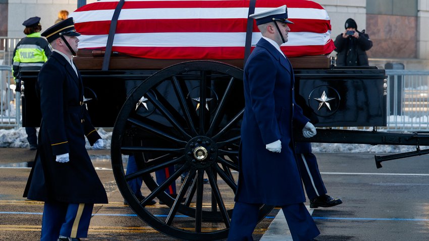 The US Army's Caisson Detachment carries the casket of Jimmy Carter, the former US president who died on December 29 at the age of 100, to lie in state at the US Capitol building in Washington