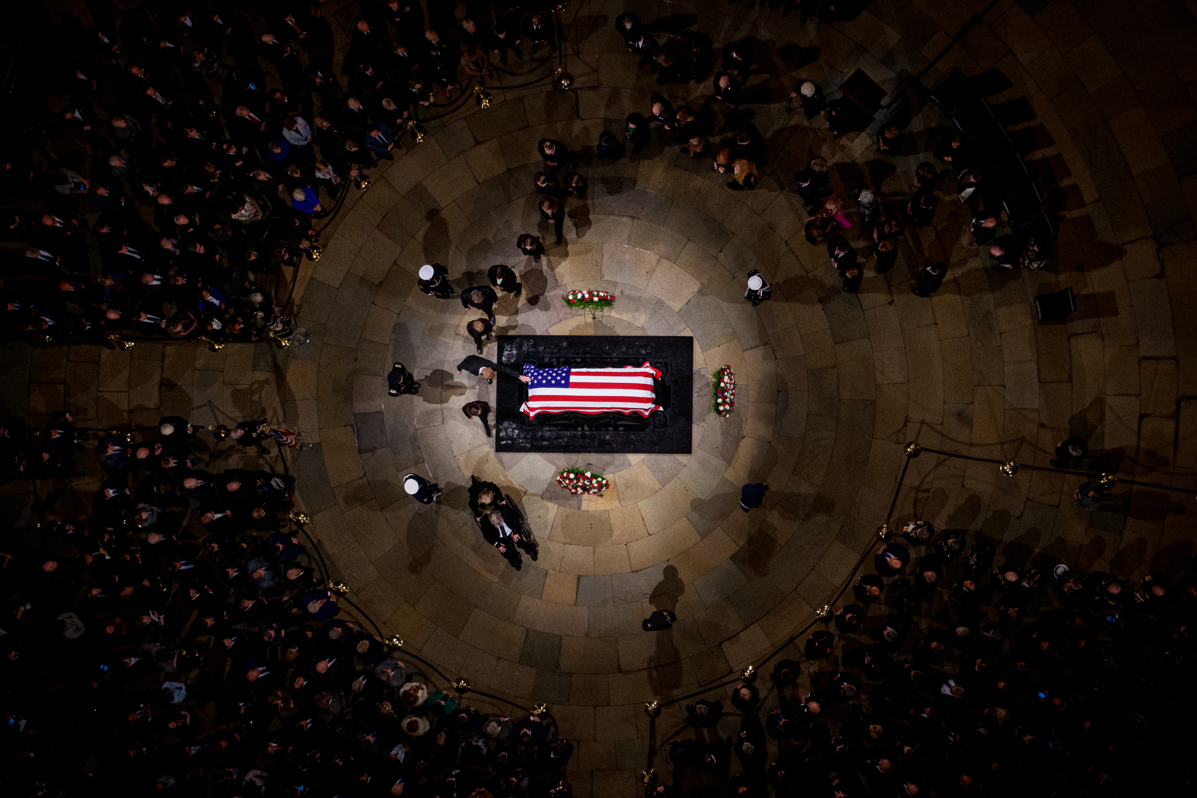 A family member touches the flag-draped casket of former U.S. President Jimmy Carter as he lies in state in the U.S. Capitol Rotunda on January 7, 2025 in Washington, DC.