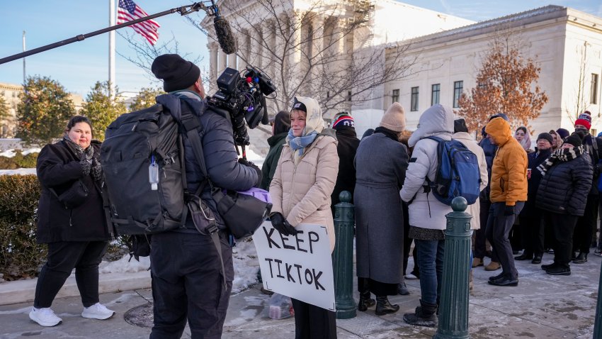 WASHINGTON, DC - JANUARY 10: Sarah Baus of Charleston, S.C., a content creator on TikTok, speaks to a film crew while holding a sign that reads "Keep TikTok" outside the U.S. Supreme Court Building as the court hears oral arguments on whether to overturn or delay a law that could lead to a ban of TikTok in the U.S., on January 10, 2025 in Washington, DC.