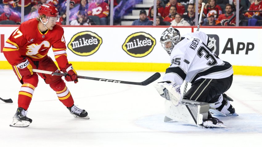 CALGARY, CANADA – NOVEMBER 11: Darcy Kuemper #35 of the Los Angeles Kings stops a shot on net from Connor Zary #47 of the Calgary Flames during the first period at the Scotiabank Saddledome on November 11, 2024, in Calgary, Alberta, Canada. (Photo by Leah Hennel/Getty Images)