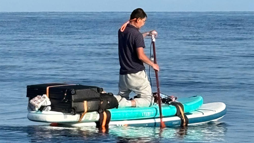 The U.S. Coast Guard found a Chinese migrant floating on a paddleboard off the Bahamas, officials said.