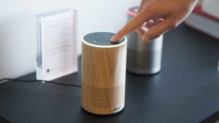 An attendee operates the new Amazon Echo device.