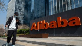 Signage at the Alibaba Group Holding Ltd. offices in Beijing, China, on Wednesday, March 29, 2023. Alibaba’s overhaul could serve as a template for a restructuring of China Tech itself: a shake-up that achieves Beijings aim of carving up the countrys tech titans while unlocking potentially billions of dollars in pent-up shareholder value.