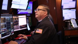 Traders work on the floor of the New York Stock Exchange during the morning trading on November 07, 2024 in New York City.