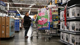 People shop during the Friday shopping rush at a Walmart in Mountain View, California, United States on November 29, 2024.
