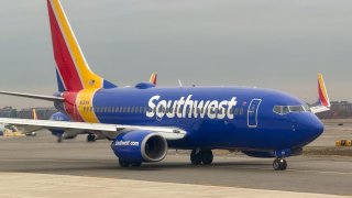 A Southwest Airlines Boeing 737 passenger plane taxis along the tarmac at the Ronald Reagan Washington National Airport (DCA) in Arlington, Virginia on December 13, 2024.
